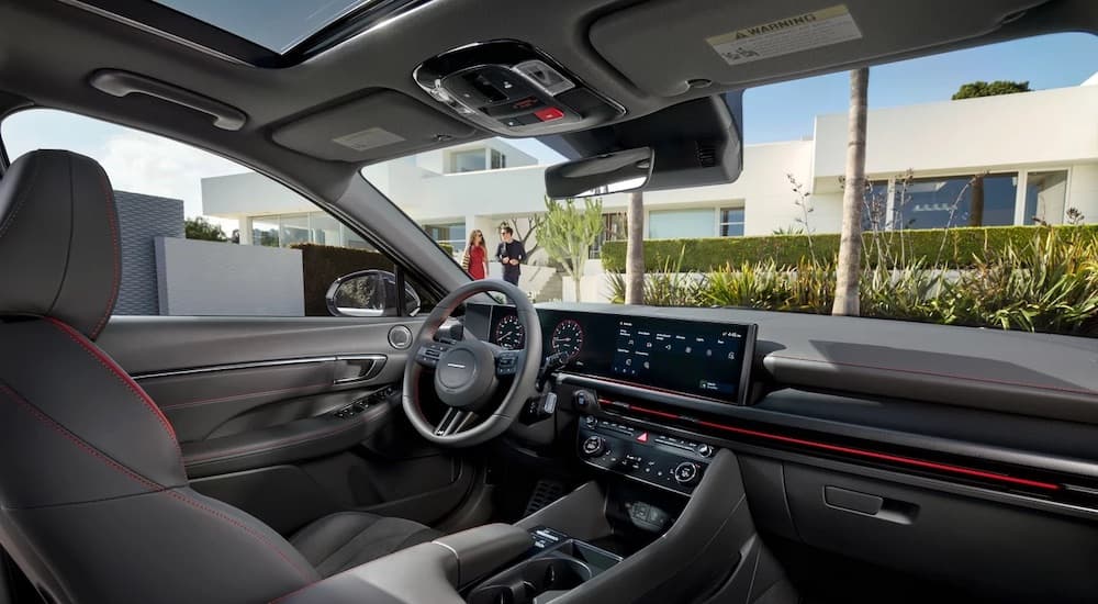 The black interior of a 2024 Hyundai Sonata N-Line is shown from the passenger seat.