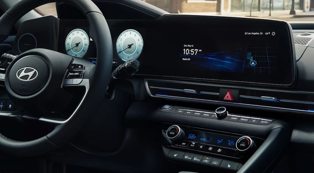 The digital dash and infotainment screen in a 2024 Hyundai Elantra for sale.