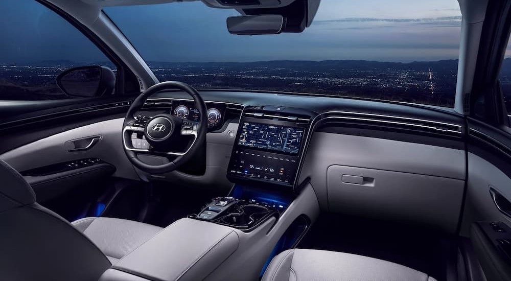 The cabin of a 2024 Hyundai Tucson Hybrid at a Hyundai dealer near Clinton.