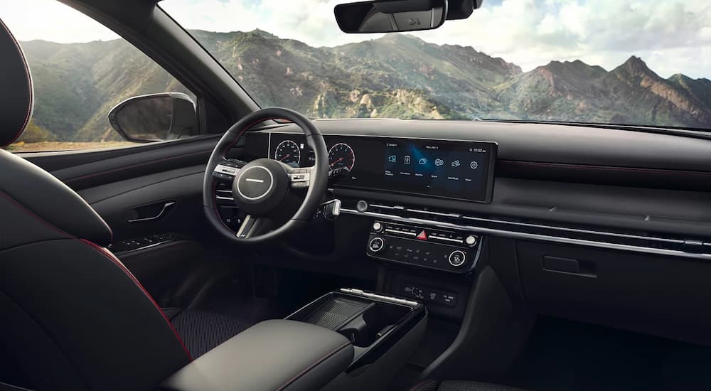 The center console and dashboard of a 2025 Hyundai Tucson Hybrid N-Line at a Hyundai dealer near Seymour.