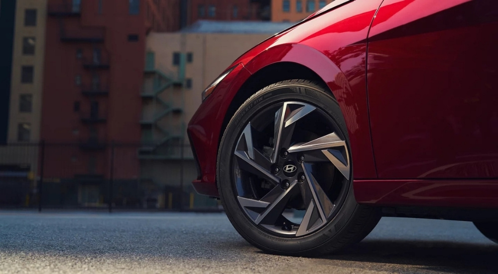 Close-up of the front wheel of a red 2025 Hyundai Elantra Limited.