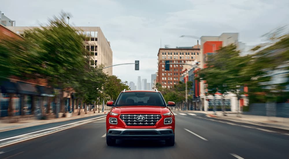 Red 2025 Hyundai Venue leaving a Hyundai dealer near Morristown.