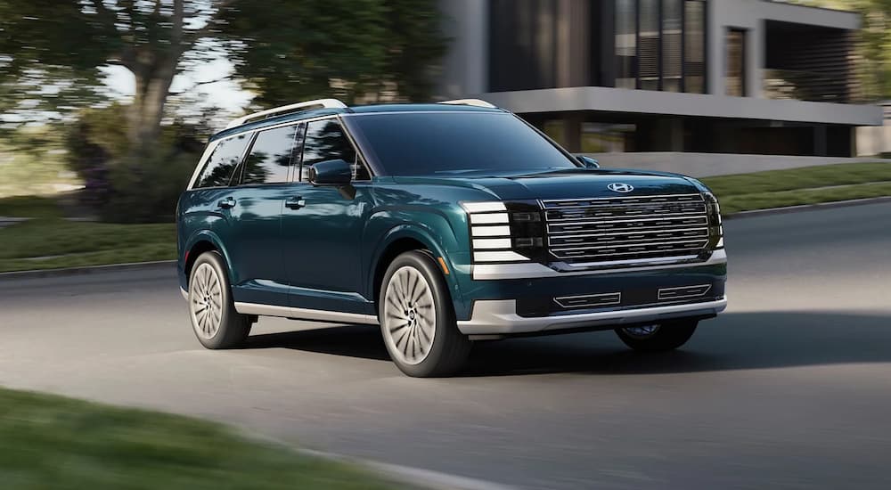 A blue 2026 Hyundai Palisade driving for sale near Oak Ridge