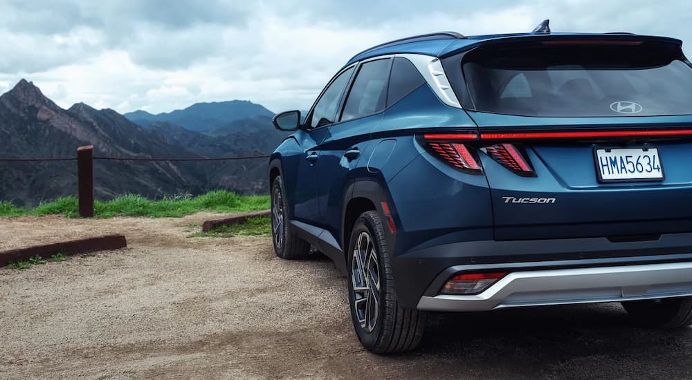 Rear view of the liftgate and brake lights on a blue 2026 Hyundai Tucson