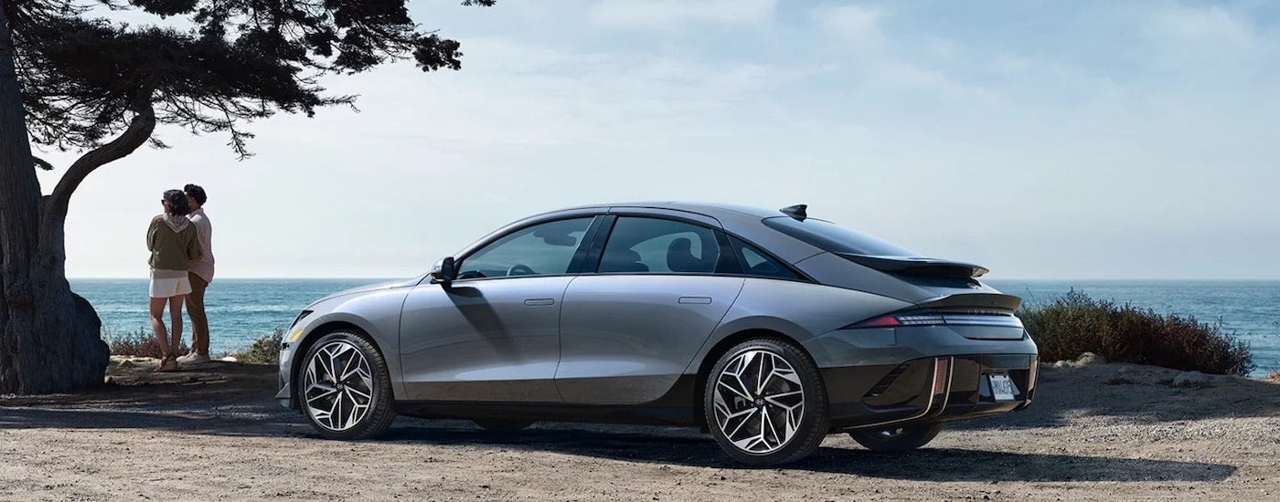 A grey 2023 Hyundai Ioniq 6 is shown from the side.
