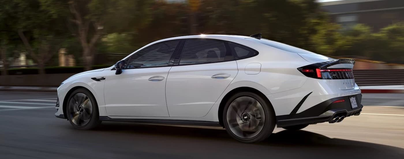 A white 2024 Hyundai Sonata N-Line is shown from the side.