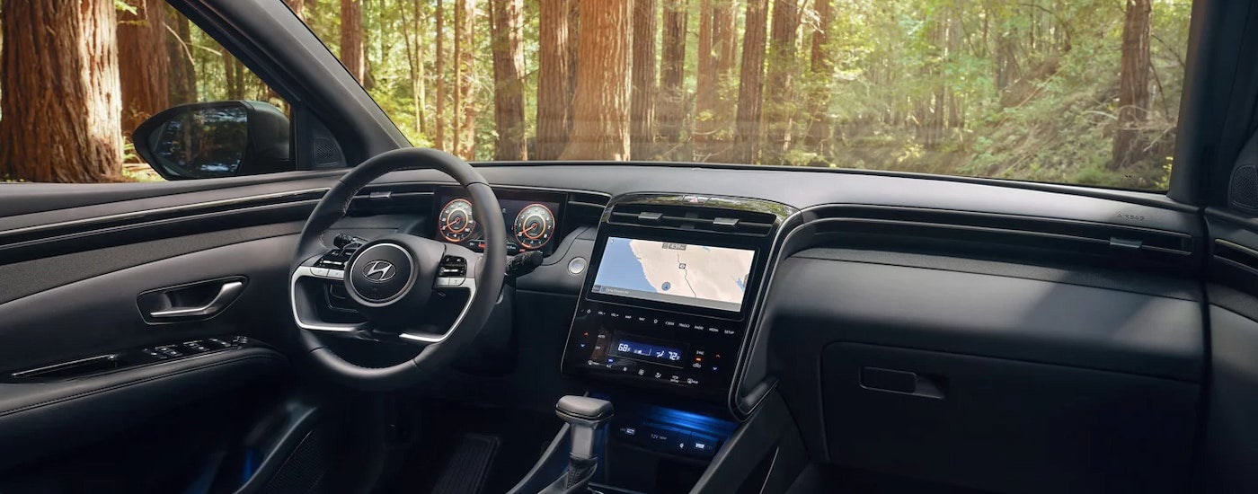 The black interior of a 2024 Hyundai Santa Cruz for sale.