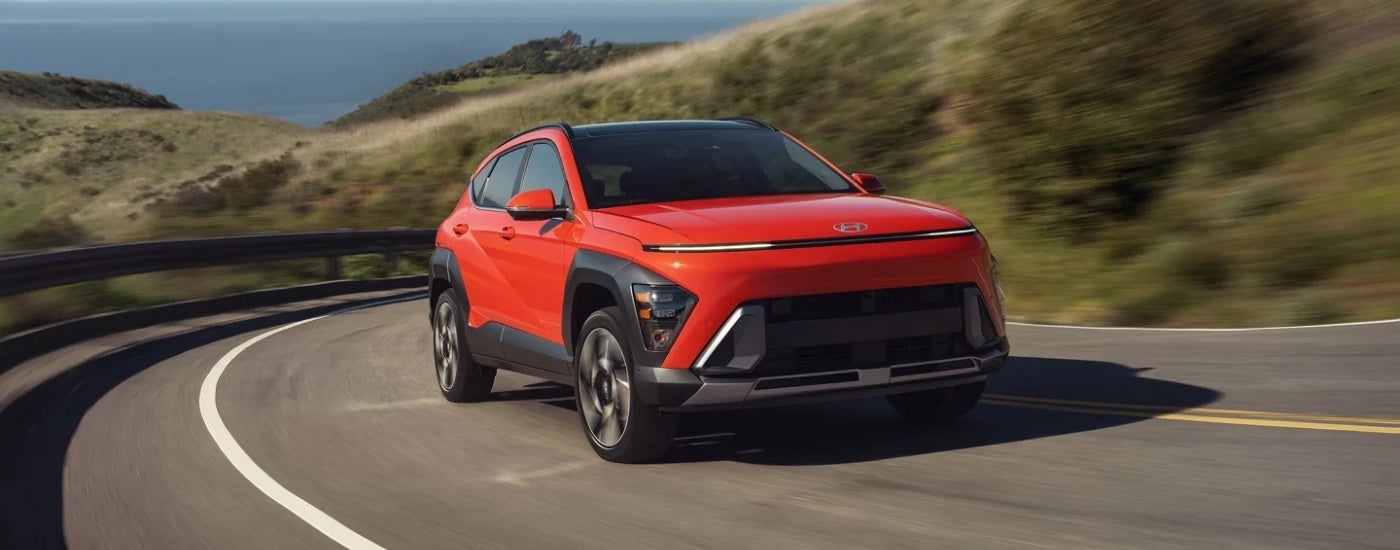 An orange 2026 Hyundai KONA from the front at an angle.