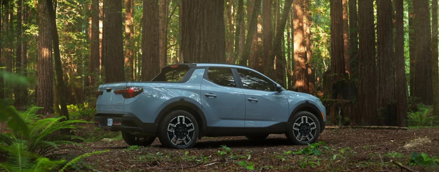 Blue 2026 Hyundai Santa Cruz parked in the woods