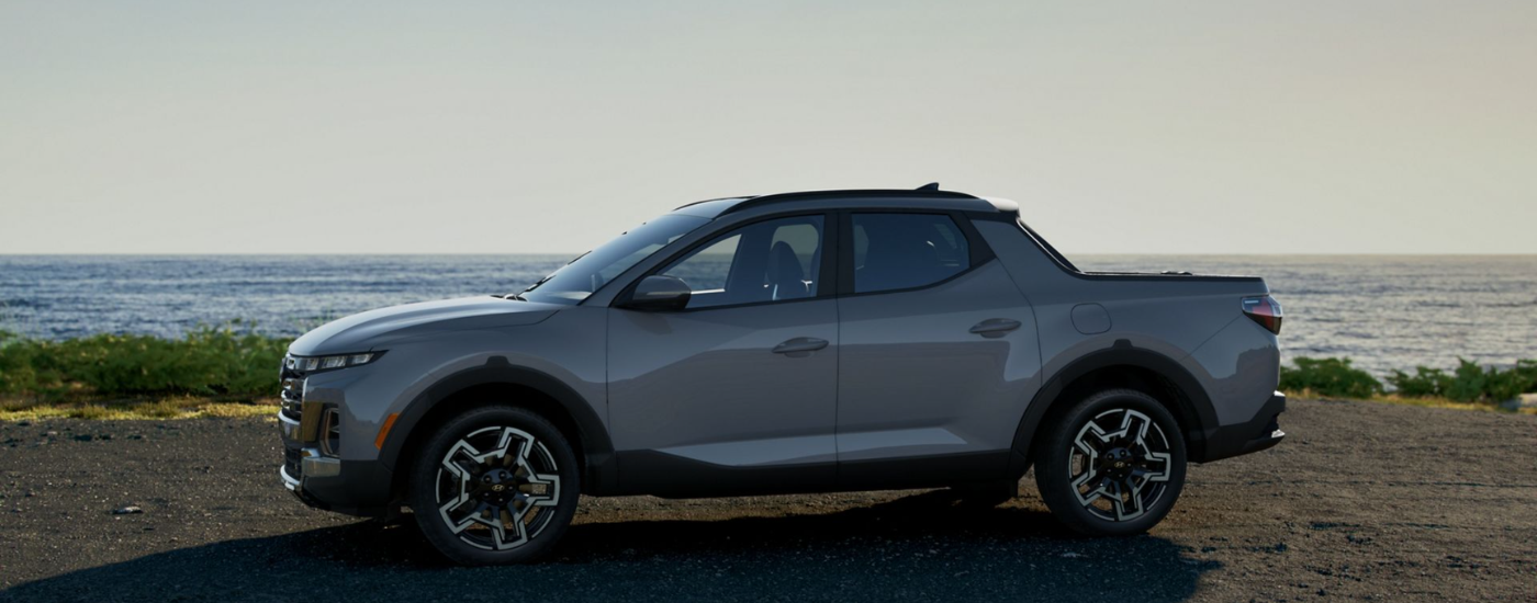 Blue 2026 Hyundai Santa Cruz parked by water