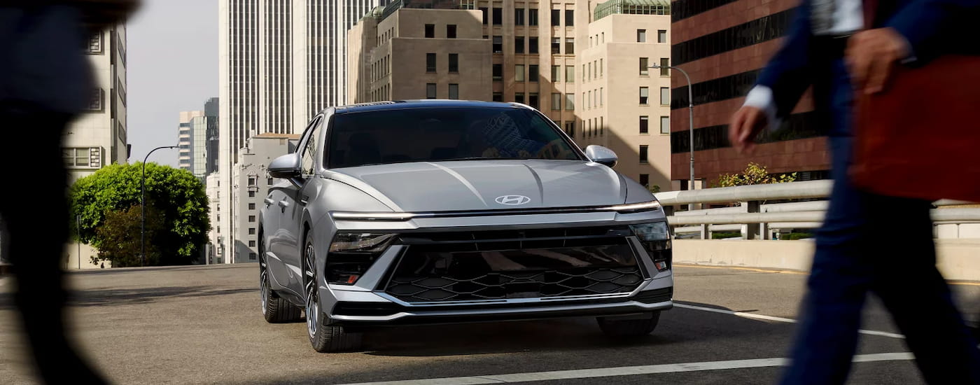 Grey 2026 Hyundai Sonata driving on a street.