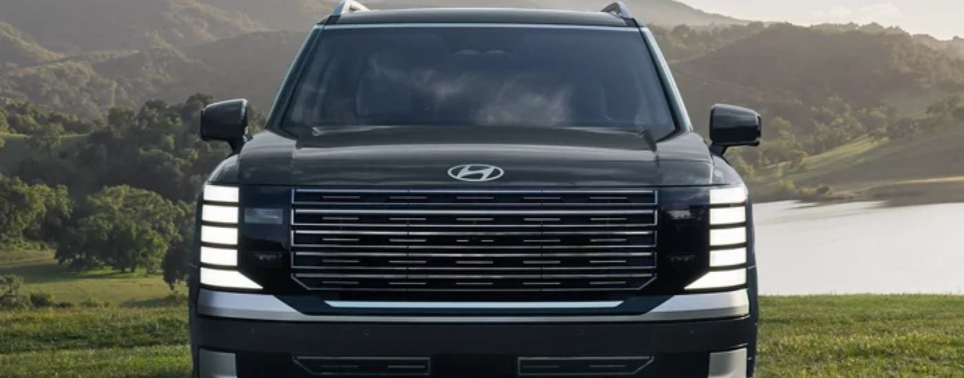 Front grille of a green 2027 Hyundai Palisade Hybrid.