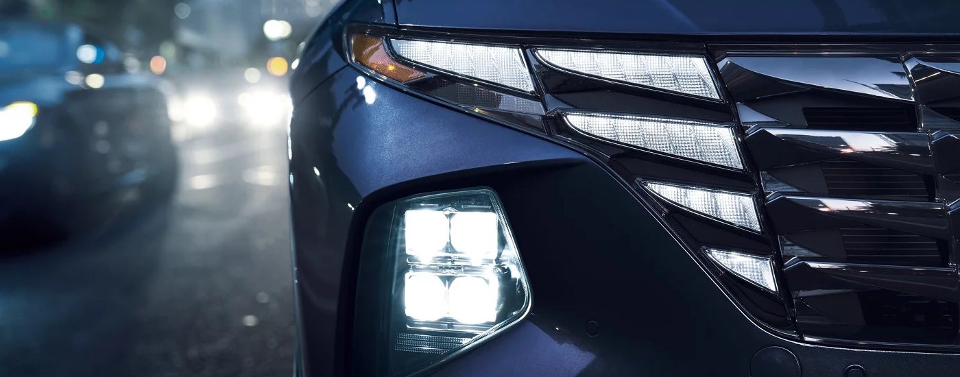 Close-up of the headlights on a 2024 Hyundai Tucson Hybrid at a Hyundai Dealer Near Maryville.