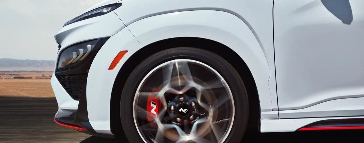 Close-up on the wheel and rim of a white 2022 Hyundai Kona N.